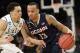 Connecticut's Shabazz Napier, right, moves the ball around Michigan State's Travis Trice in the first half of a regional final at the NCAA college basketball tournament on Sunday, March 30, 2014, in New York. (AP Photo/Seth Wenig)