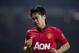 Manchester United's Shinji Kagawa winces as his team lose 3-0 to Manchester City during their English Premier League soccer match at Old Trafford Stadium, Manchester, England, Tuesday, March 25, 2014. (AP Photo/Jon Super)