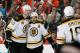 PHILADELPHIA, PA - MARCH 30: Patrice Bergeron #37 of the Boston Bruins celebrates his second period goal against the Philadelphia Flyers with teammates Zdeno Chara #33 and Reilly Smith #18 on March 30, 2014 at the Wells Fargo Center in Philadelphia, Pennsylvania. (Photo by Len Redkoles/NHLI via Getty Images)