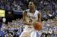 Kentucky's Aaron Harrison dribbles during the first half of an NCAA college basketball game against Louisville, Saturday, Dec. 28, 2013, in Lexington, Ky. (AP Photo/James Crisp)