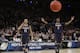 Connecticut's Shabazz Napier (13) and DeAndre Daniels (2) gesture to their teammates during the second half of a regional final against Michigan State in the NCAA college basketball tournament, Sunday, March 30, 2014, in New York. Connecticut won 60-54. (AP Photo/Frank Franklin II)