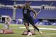 Minnesota defensive lineman Ra'Shede Hageman runs a drill at the NFL football scouting combine in Indianapolis, Monday, Feb. 24, 2014. (AP Photo/Michael Conroy)