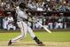 San Francisco Giants' Buster Posey connects for a 2-run home run against the Arizona Diamondbacks during the ninth inning of an opening day baseball game, Monday, March 31, 2014, in Phoenix. (AP Photo/Ross D. Franklin)