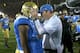 LOS ANGELES, CA - NOVEMBER 30: Head coach Jim Mora of the UCLA Bruins embraces wide receiver Shaquelle Evans #1 after the game against the USC Trojans at Los Angeles Coliseum on November 30, 2013 in Los Angeles, California. The Bruins won 35-14. (Photo by Stephen Dunn/Getty Images)