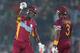 DHAKA, BANGLADESH - APRIL 01: Dwayne Bravo and Darren Sammy of the West Indies gesture after hitting a boundary during the ICC World Twenty20 Bangladesh 2014 match between West Indies and Pakistan at Sher-e-Bangla Mirpur Stadium on April 1, 2014 in Dhaka, Bangladesh. (Photo by Scott Barbour/Getty Images)