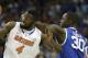 Florida center Patric Young (4) and Kentucky forward Julius Randle (30) vie for a loose ball during the first half of an NCAA college basketball game in the Championship round of the Southeastern Conference men's tournament, Sunday, March 16, 2014, in Atlanta. (AP Photo/Steve Helber)
