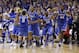 Kentucky players celebrate after an NCAA Midwest Regional final college basketball tournament game against Michigan Sunday, March 30, 2014, in Indianapolis. Kentucky won 75-72 to advance to the Final Four.(AP Photo/Michael Conroy)