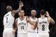 Brooklyn Nets forward Paul Pierce (34), second from right, celebrates with forward Kevin Garnett (2), point guard Shaun Livingston (14), and point guard Deron Williams (8) after scoring in the second half of an NBA basketball game against the Charlotte Bobcats, Wednesday, Feb. 12, 2014, in New York. The Nets won 105-89. (AP Photo/John Minchillo)