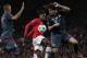 Manchester United's Danny Welbeck, center, challenges for the ball with Bayern's Javier Martinez, right, and Jerome Boateng during the Champions League quarterfinal first leg soccer match between Manchester United and Bayern Munich at Old Trafford Stadium, Manchester, England, Tuesday, April 1, 2014.(AP Photo/Jon Super)