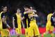 Atletico's Diego, centre celebrates with Koke after scoring during a first leg quarterfinal Champions League soccer match between Barcelona and Atletico Madrid at the Camp Nou stadium in Barcelona, Spain, Tuesday April 1, 2014. (AP Photo/Manu Fernandez)