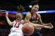 Louisville forward Cortnee Walton (13) and Maryland forward Alyssa Thomas scramble for a rebound during the first half of a regional final in the NCAA women's college basketball tournament, Tuesday, April 1, 2014, in Louisville, Ky. (AP Photo/John Bazemore)
