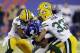 New York Giants wide receiver Victor Cruz (80) is tackled by Micah Hyde (33), Davon House, and Jarrett Bush, left, during the first half of an NFL football game Sunday, Nov. 17, 2013, in East Rutherford, N.J. (AP Photo/Seth Wenig)
