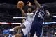 Denver Nuggets forward Kenneth Faried (35) goes up for a shot against Memphis Grizzlies forward Zach Randolph (50) during the third quarter of an NBA basketball game on Monday, March 31, 2014, in Denver. (AP Photo/Jack Dempsey)