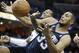 San Antonio Spurs' Boris Diaw (33), of France, gets a defensive rebound from Memphis Grizzlies' James Johnson in the first half of an NBA basketball game in Memphis, Tenn., Tuesday, Jan. 7, 2014. (AP Photo/Danny Johnston)