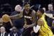 Miami Heat forward LeBron James, left, is defended by Indiana Pacers forward Paul George in the second half of an NBA basketball game in Indianapolis, Tuesday, Dec. 10, 2013. The Pacers won 90-84. (AP Photo/Michael Conroy)
