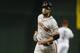 San Francisco Giants first baseman Brandon Belt (9) runs the bases after hitting a three run homerun against the Arizona Diamondbacks in the first inning during a baseball game against the Arizona Diamondbacks, Tuesday, April 1, 2014, in Phoenix. (AP Photo/Rick Scuteri)
