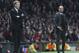 Manchester United's manager David Moyes, left, and Bayern head coach Pep Guardiola watch the Champions League quarterfinal first leg soccer match between Manchester United and Bayern Munich at Old Trafford Stadium, Manchester, England, Tuesday, April 1, 2014.(AP Photo/Jon Super)