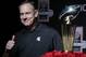 Michigan State head coach Mark Dantonio poses by the Trophy after a news conference in Los Angeles, Monday, Dec. 30, 2013. Michigan State is to face Stanford in the 100th Rose Bowl NCAA college football game on New Year's Day. (AP Photo/Chris Carlson)