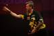 LONDON, ENGLAND - DECEMBER 30: Simon Whitlock of Australia in action during his semi final match against Peter Wright of Scotland on day fifteen of the Ladbrokes.com World Darts Championship at Alexandra Palace on December 30, 2013 in London, England. (Photo by Ben Hoskins/Getty Images)