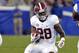 Alabama's Altee Tenpenny finds an opening in the Kentucky defensive line during the fourth quarter of an NCAA college football game, Saturday, Oct. 12, 2013, at Commonwealth Stadium in Lexington, Ky. Alabama defeated Kentucky 48-7. (AP Photo/Timothy D. Easley)