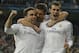 Real's Gareth Bale, right, celebrates scoring the opening goal with Real's Daniel Carvajal, left, and Xabi Alonso, center, during a Champions League quarterfinal first leg soccer match between Real Madrid and Borussia Dortmund at the Santiago Bernabeu stadium in Madrid, Spain, Wednesday April 2, 2014. (AP Photo/Paul White)