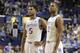 Kentucky's Andrew Harrison (5) and Aaron Harrison (2) during an NCAA college basketball game against Mississippi, Tuesday, Feb. 4, 2014, in Lexington, Ky. Kentucky won 80-64. (AP Photo/James Crisp)
