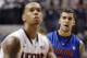 Florida's Scottie Wilbekin, right, watches Connecticut's Shabazz Napier shoot a free throw during the first half of an NCAA college basketball game, Monday, Dec. 2, 2013, in Storrs, Conn. (AP Photo/Jessica Hill)
