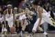 Maryland guard Laurin Mincy, left, Notre Dame guard Michaela Mabrey, center, and Maryland forward Alyssa Thomas chase after a loose ball in the first half of an NCAA college basketball game in College Park, Md., Monday, Jan. 27, 2014. (AP Photo/Patrick Semansky)
