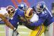 New York Giants defensive tackle Linval Joseph (97) and linebacker Jon Beason (52) tackles Washington Redskins' Alfred Morris during the first half of an NFL football game Sunday, Dec. 29, 2013, in East Rutherford, N.J. Redskins' Chris Chester (66) moves in on the play. (AP Photo/Bill Kostroun)