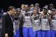 Kentucky head coach John Calipari, left, and players celebrate after an NCAA Midwest Regional final college basketball tournament game Sunday, March 30, 2014, in Indianapolis. Kentucky won 75-72 to advance to the Final Four. (AP Photo/David J. Phillip)