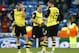 Dortmund's Kevin Grosskreutz, Jonas Hofmann and Julian Schieber, from left, ponder after the Champions League quarterfinal first leg soccer match between Real Madrid and Borussia Dortmund at the Santiago Bernabeu stadium in Madrid, Spain, Wednesday, April 2, 2014. (AP Photo/Andres Kudacki)
