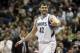 Minnesota Timberwolves' Kevin Love , left, congratulates Corey Brewer after Brewer's dunk in the first quarter of an NBA basketball game against the Detroit Pistons, Friday, March 7, 2014, in Minneapolis. (AP Photo/Jim Mone)