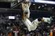 Michigan State's Adreian Payne (5) celebrates while hanging on the rim after dunking the basketball during the first half of a Coaches vs. Cancer NCAA college basketball game against the Virginia Tech, Friday, Nov. 22, 2013, in New York. (AP Photo/Frank Franklin II)