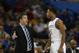 Kentucky head coach John Calipari speaks to Kentucky guard Andrew Harrison (5) against LSU during the first half of an NCAA college basketball game in the quarterfinal round of the Southeastern Conference men's tournament, Friday, March 14, 2014, in Atlanta. (AP Photo/John Bazemore)