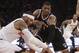 Brooklyn Nets' Joe Johnson (7) and New York Knicks' Carmelo Anthony (7) fight for control of the ball during the first half of an NBA basketball game Wednesday, April 2, 2014, in New York. (AP Photo/Frank Franklin II)