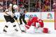 DETROIT, MI - APRIL 2: Jimmy Howard #35 of the Detroit Red Wings makes a break away save on Patrice Bergeron #37 of the Boston Bruins during an NHL game on April 2, 2014 at Joe Louis Arena in Detroit, Michigan. (Photo by Dave Reginek/NHLI via Getty Images)
