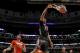 McDonald's West All-American Jahlil Okafor dunks the ball past McDonald's East All-American Karl-Anthony Towns, left, during the second half of the McDonald's All-American boy's basketball game Wednesday, April 2, 2014, in Chicago. The West won 105-102. (AP Photo/Charles Rex Arbogast)