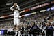 Dallas Mavericks' Vince Carter (25) goes up for a 3-point basket in front of the Sacramento Kings bench during an NBA basketball game, Saturday, March 29, 2014, in Dallas. (AP Photo/Tony Gutierrez)