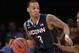 Connecticut's Shabazz Napier (13) is defended by Iowa State's Monte Morris (11) during the first half in a regional semifinal at the NCAA college basketball tournament Friday, March 28, 2014 in New York. (AP Photo/Frank Franklin II)