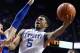 Kentucky guard Andrew Harrison (5) runs on Florida guard Michael Frazier II (20) during the first half of an NCAA college basketball game in the Championship round of the Southeastern Conference men's tournament, Sunday, March 16, 2014, in Atlanta. (AP Photo/Steve Helber)