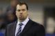 FILE - In this Dec. 15, 2013, file photo, Indianapolis Colts general manager Ryan Grigson watches warm-ups before an NFL football game against the Houston Texans in Indianapolis. The Colts are projected to be about $31 million under the salary cap heading into this offseason, and Grigson is looking to plug more holes on his team. (AP Photo/Darron Cummings, file)