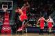 Bulls center Joakim Noah and forward Jimmy Butler celebrate during a timeout.