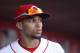 Cincinnati Reds' Billy Hamilton walks through the dugout during a baseball game against the St. Louis Cardinals, Monday, March 31, 2014, on opening day in Cincinnati. (AP Photo/David Kohl)