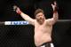 Roy Nelson celebrates his win over Cheick Kongo after their UFC 159 Mixed Martial Arts heavyweight bout in Newark, NJ, Saturday, April 27,2013. Nelson won via first round KO. (AP Photo/Gregory Payan)