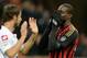 MILAN, ITALY - NOVEMBER 23: Mario Balotelli of AC Milan dejected during the Serie A match between AC Milan and Genoa CFC at Stadio Giuseppe Meazza on November 23, 2013 in Milan, Italy. (Photo by Claudio Villa/Getty Images)