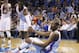Oklahoma City Thunder forward Kevin Durant (35) is helped up by teammate Reggie Jackson (15) after falling in the second quarter of an NBA basketball game against the San Antonio Spurs in Oklahoma City, Thursday, April 3, 2014. (AP Photo/Sue Ogrocki)
