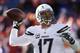 San Diego Chargers quarterback Philip Rivers warms up before playing against the Denver Broncos in an NFL AFC division playoff football game, Sunday, Jan. 12, 2014, in Denver. (AP Photo/Charlie Riedel)