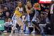 Memphis Grizzlies forward Tayshaun Prince (21) plays against Denver Nuggets guard Randy Foye during an NBA basketball game on Monday, March 31, 2014, in Denver. Memphis beat Denver 94-92. (AP Photo/Jack Dempsey)