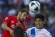 Cruz Azul's Alejandro Castro, left, heads the ball with Puebla's Uriel Alvarez at a Mexican soccer league match in Mexico City, Saturday, Feb. 15, 2014. (AP Photo/Christian Palma)