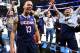 Connecticut's Shabazz Napier (13) celebrates after his team defeated Michigan State 60-54 in a regional final at the NCAA college basketball tournament, Sunday, March 30, 2014, in New York. Napier scored 17 points of his 25 points in the second half. (AP Photo/Frank Franklin II)